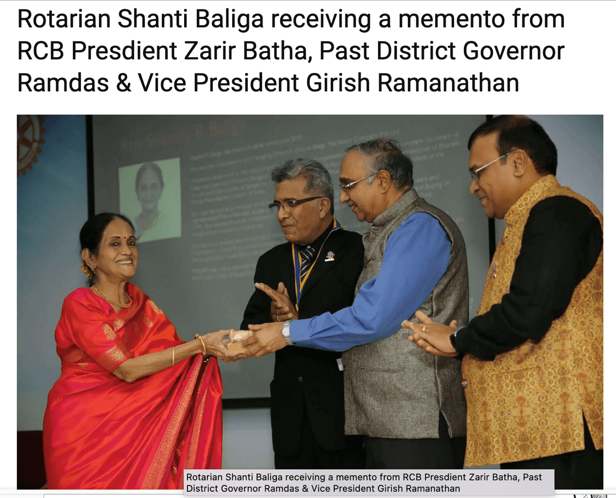 Shanthi Baliga receiving an award for her volunteer work