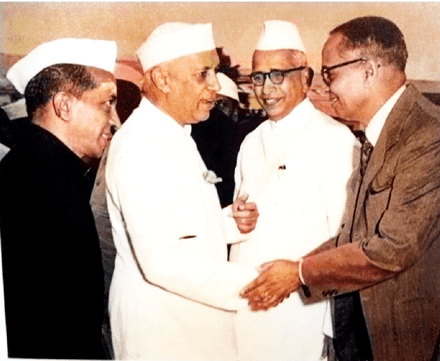 B. Vaikunta Baliga with Prime Minister Jawaharlal Nehru and other dignitaries