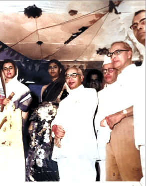 B. Vaikunta Baliga with Prime Minister Indira Gandhi and other dignitaries